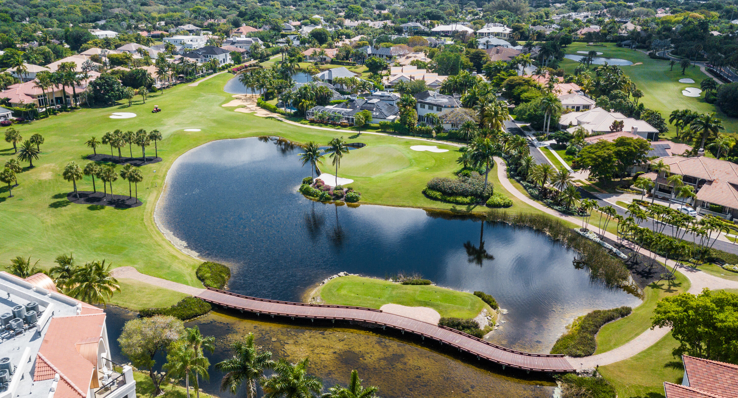7369 Orangewood Lane, Unit 303 Boca Raton, FL 33433 - Photo 4 of 56 an aerial view of a house with a lake view