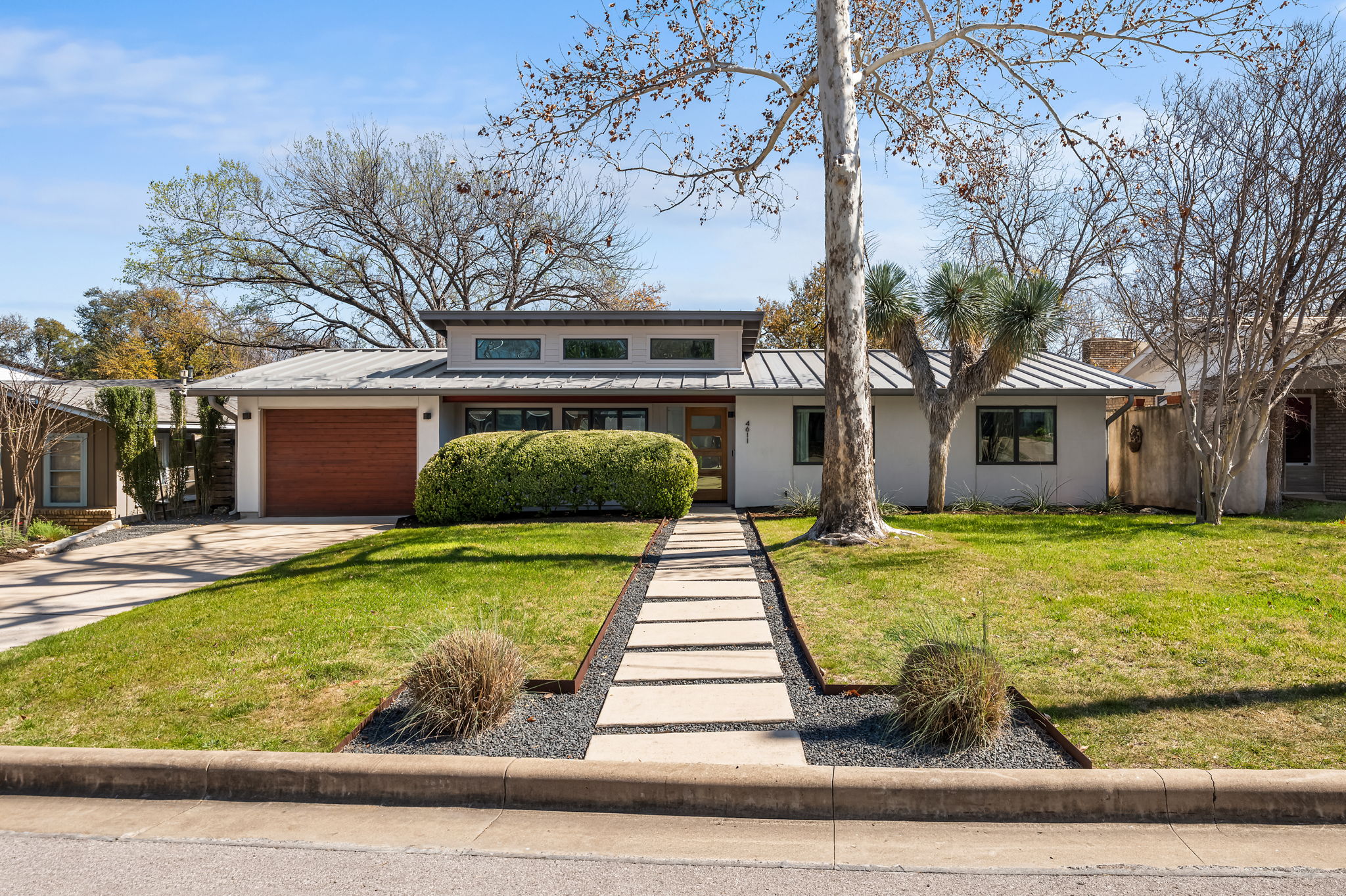 4611 Chiappero Trail Austin, TX 78731 - Photo 1 of 1 a front view of a house with garden