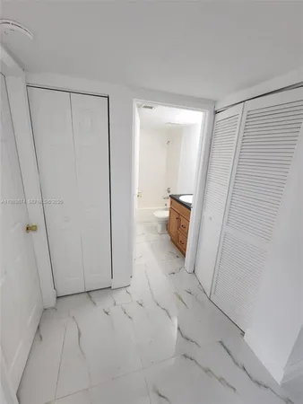 a view of storage and utility room with cabinets