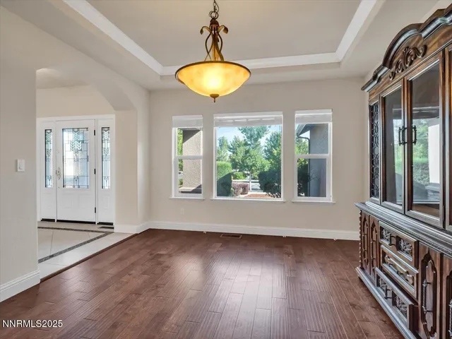 a spacious bedroom with a large bed and a flat screen tv