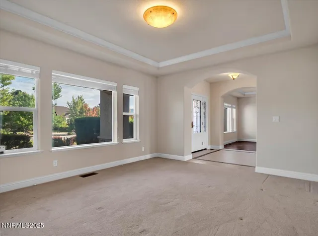 a view of walk in closet with empty racks