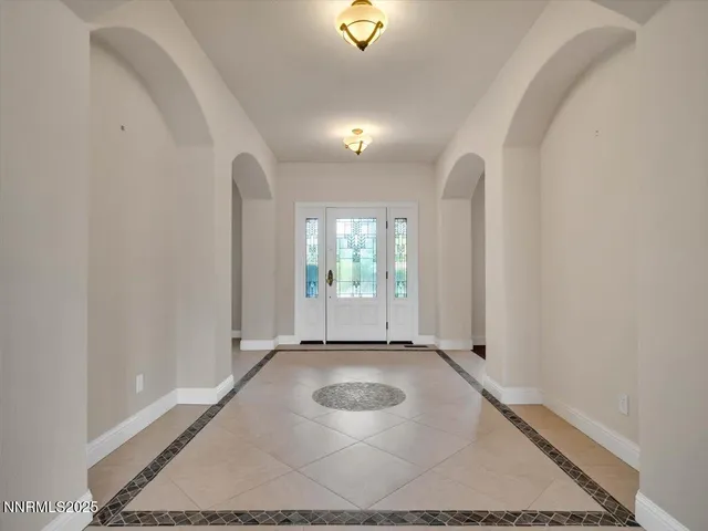 a living room with furniture kitchen view and a fireplace