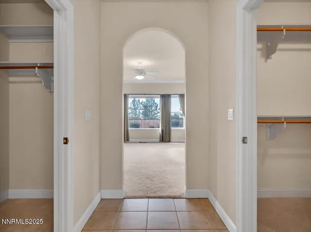 a spacious bathroom with a sink double vanity and a mirror