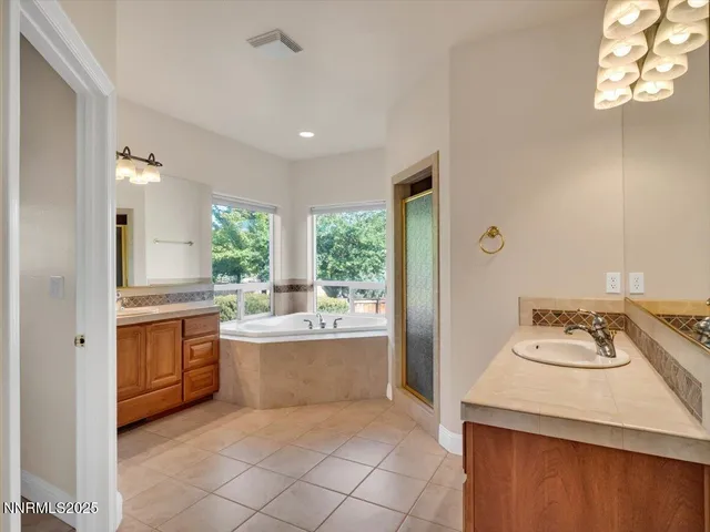 a view of house with outdoor space and sitting area
