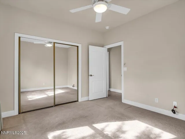 an aerial view of residential building and lake