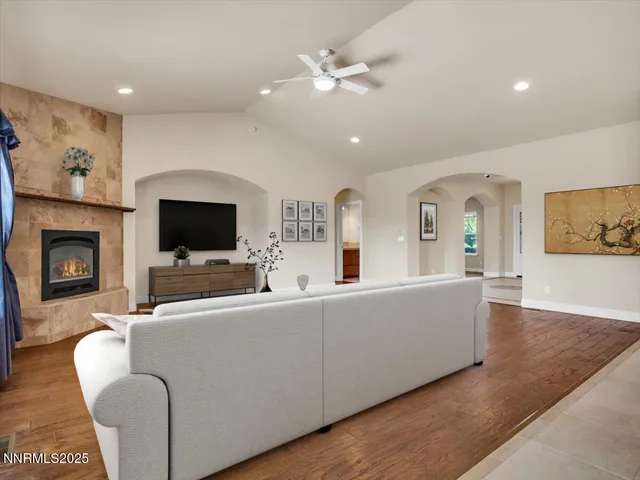 a kitchen with kitchen island a sink and a chandelier