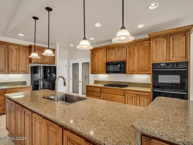 a view of empty room with wooden floor and fireplace