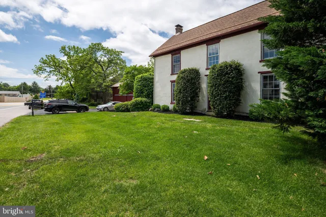 an aerial view of residential house with outdoor space and swimming pool