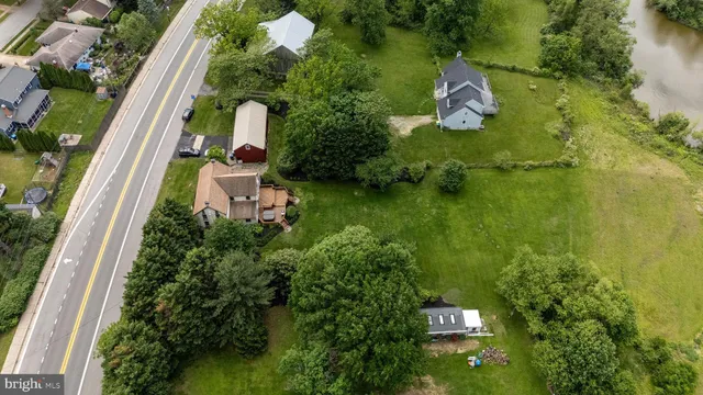 a view of a big yard with large trees