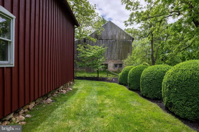 a view of a livingroom with a hardwood floor and a ceiling fan