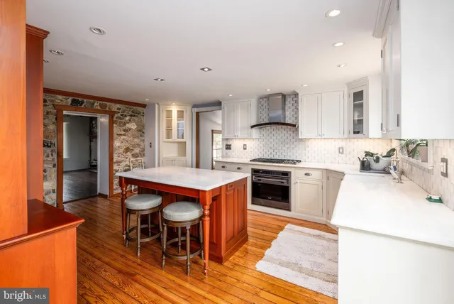a view of a room with wooden floor and window