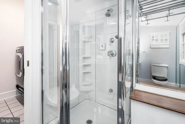 a bathroom with a sink a mirror and a bathtub