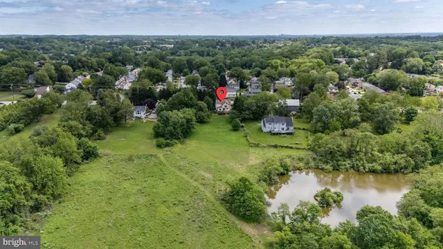 a view of house with outdoor space and sitting area