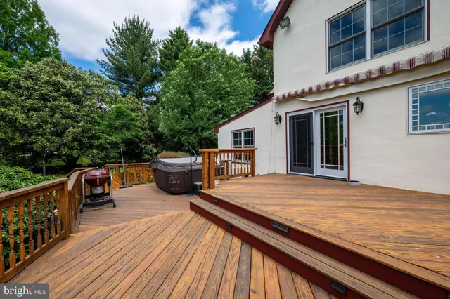 a view of a wooden deck with a yard