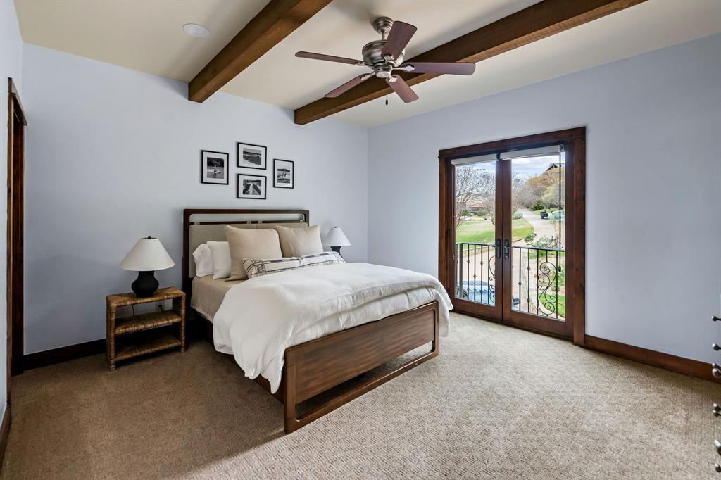 9930 Boat Club Road Fort Worth, TX 76179 - Photo 26 of 40 This upstairs bedroom with en suite in the main residence has two doors overlooking the front of the main house!