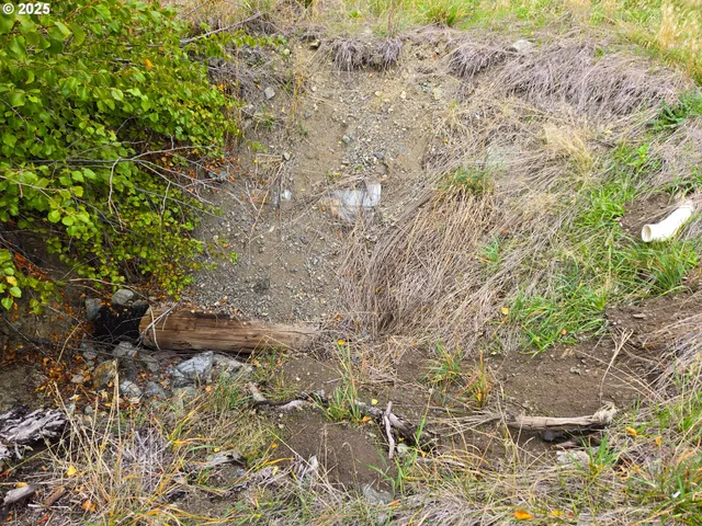 a view of a large body of water with a building in the background