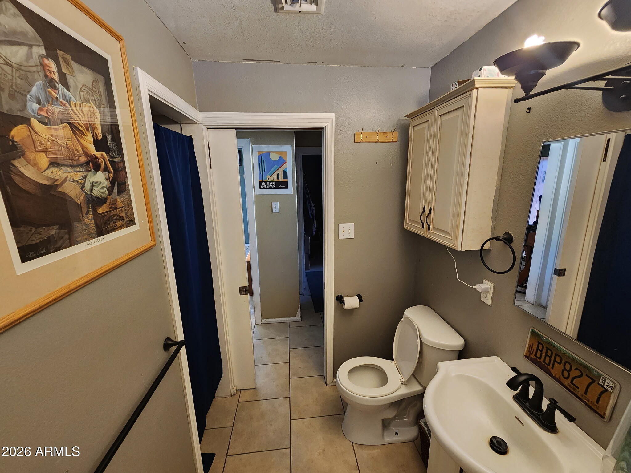 240 West 3rd Avenue Ajo, AZ 85321 - Photo 12 of 25 a bathroom with a sink toilet and shower