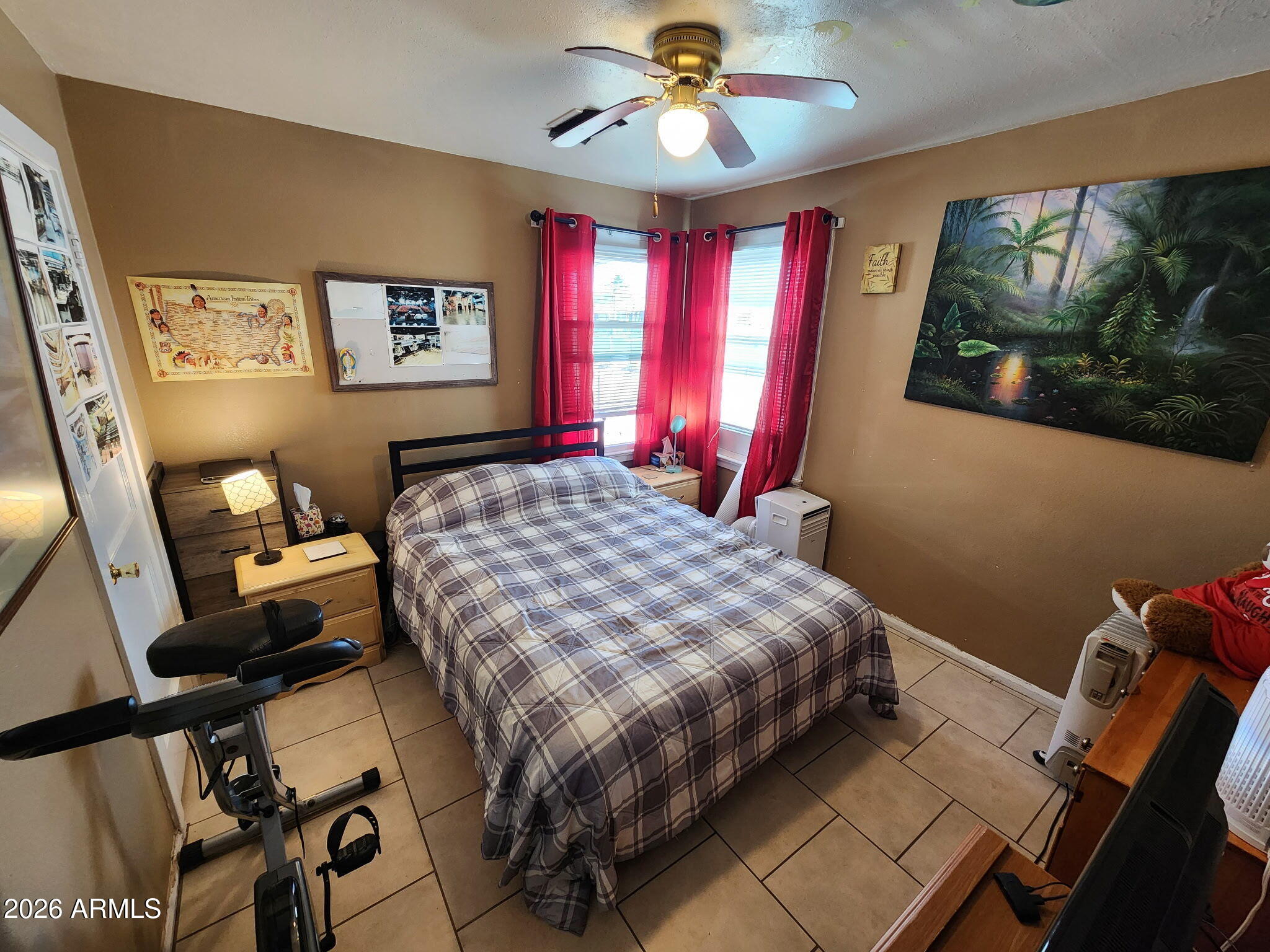 240 West 3rd Avenue Ajo, AZ 85321 - Photo 13 of 25 a bedroom with a bed and a flat screen tv