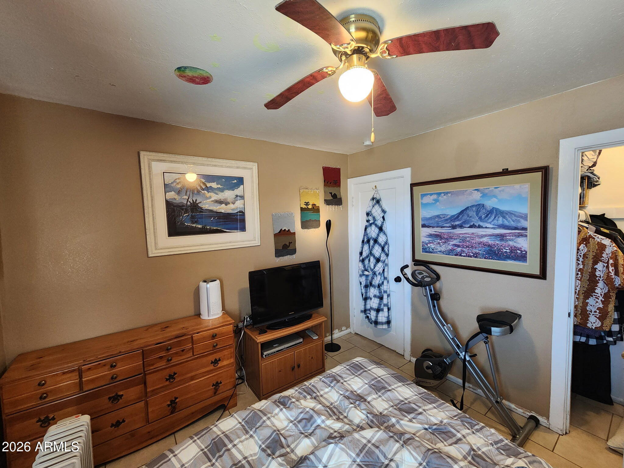 240 West 3rd Avenue Ajo, AZ 85321 - Photo 14 of 25 a bedroom with furniture and a flat screen tv