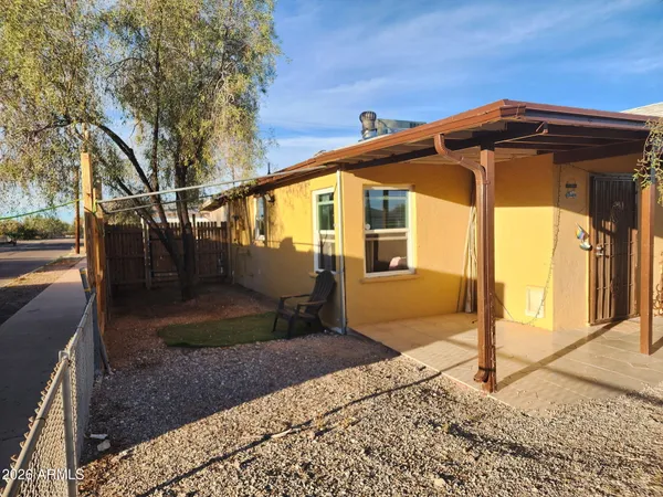 a front view of a house with parking area