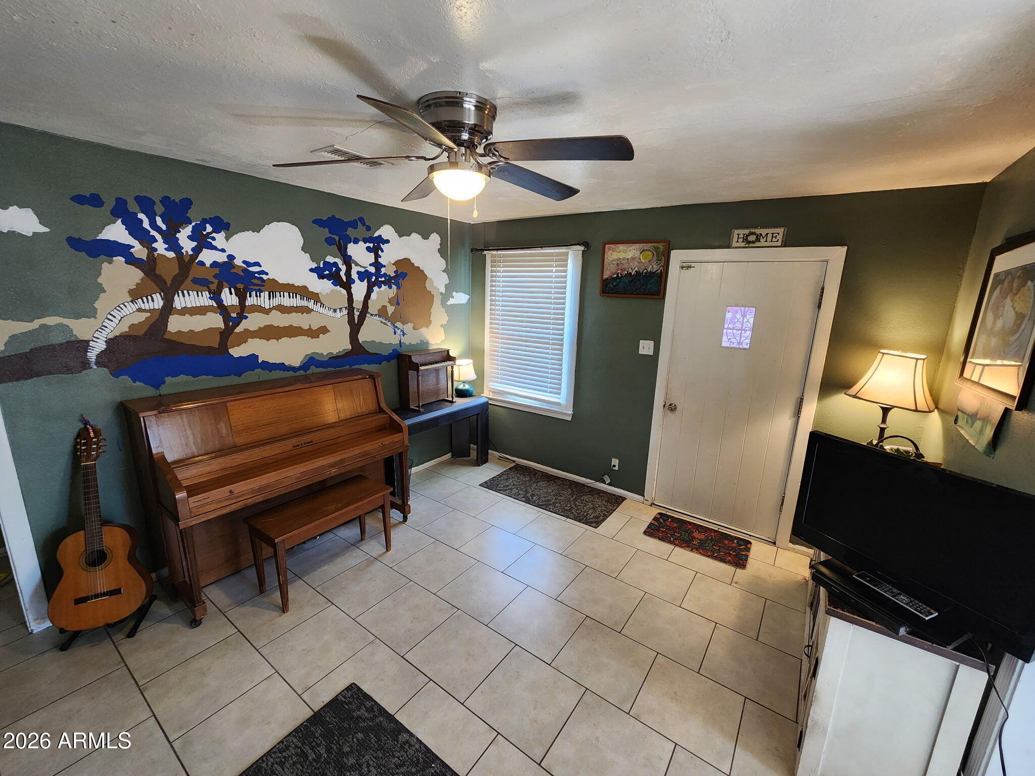 240 West 3rd Avenue Ajo, AZ 85321 - Photo 8 of 25 a bedroom with furniture and a mirror