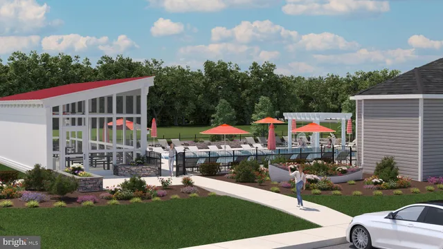 a view of a house with a yard and sitting area