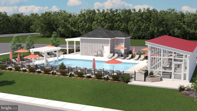 a front view of a house with a yard table and chairs