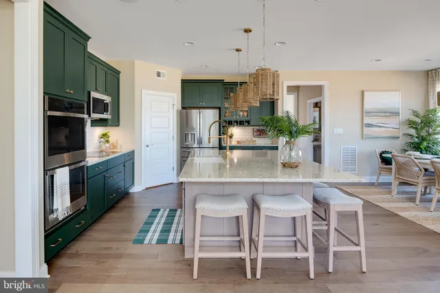 a kitchen with a table and chairs in it