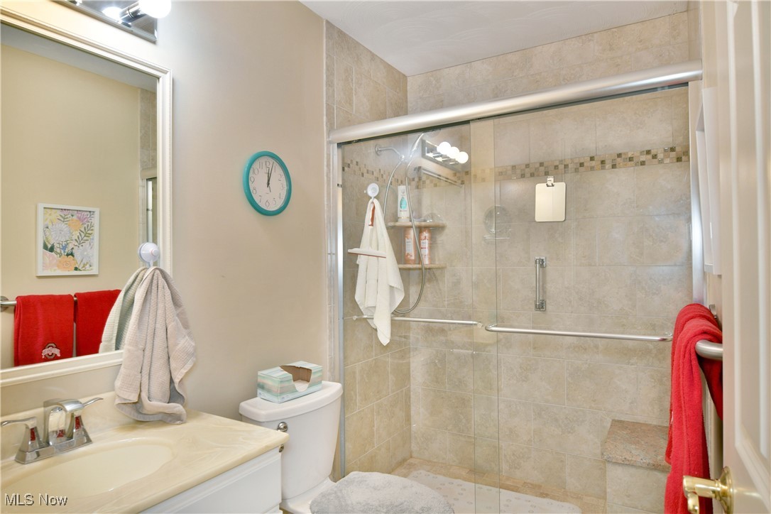 159 Mathews Road, Unit B Youngstown, OH 44512 - Photo 8 of 50 Bathroom with walk in shower, vanity, and toilet