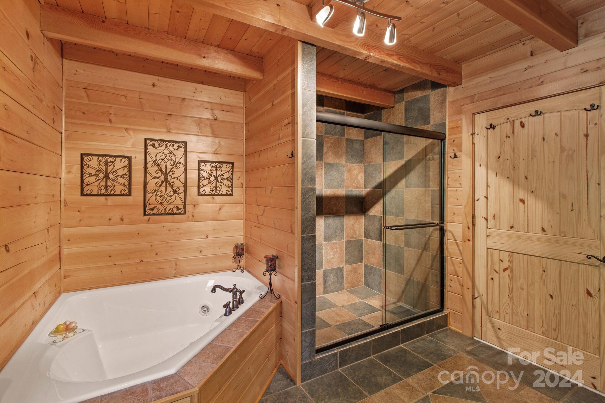 1615 Barger Road Salisbury, NC 28146 - Photo 20 of 48 a bathroom with a tub a mirror and shower