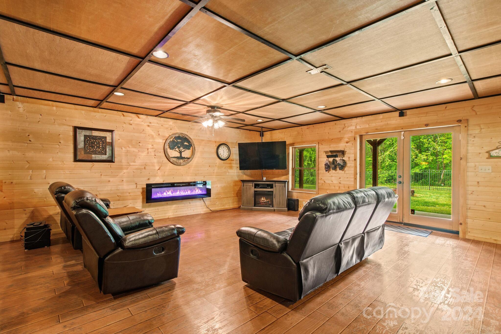 1615 Barger Road Salisbury, NC 28146 - Photo 29 of 48 a living room with furniture and a flat screen tv