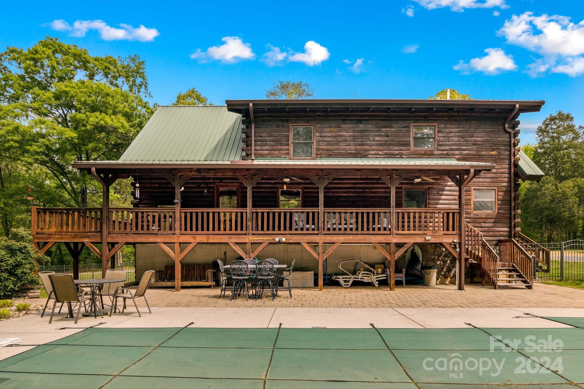 1615 Barger Road Salisbury, NC 28146 - Photo 39 of 48 a view of a patio with table and chairs with wooden floor