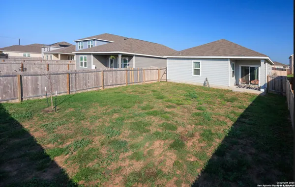a front view of a house with yard