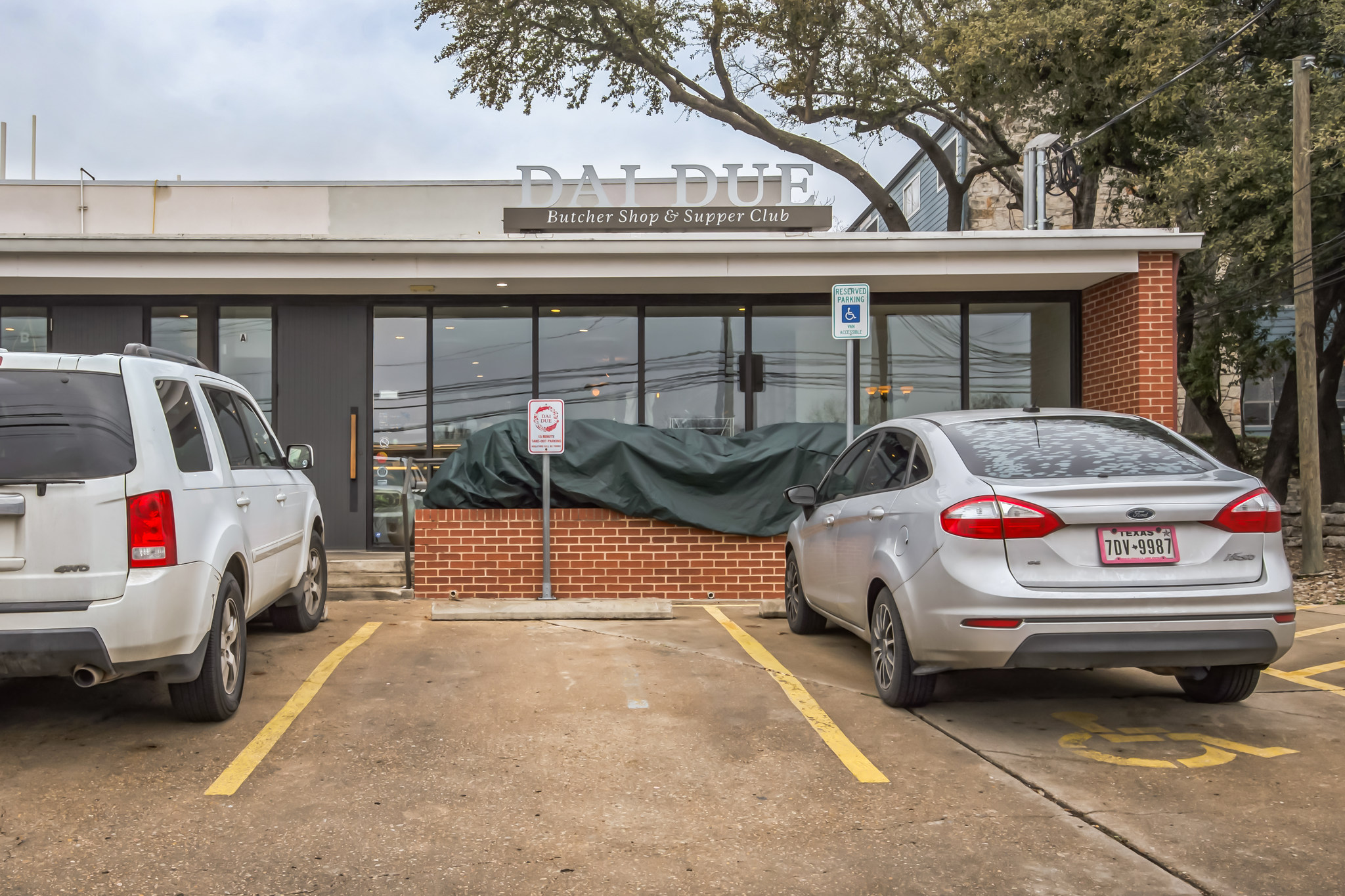 2827 Manor Road, Unit 3104 Austin, TX 78722 - Photo 30 of 30 A well-maintained facade with large windows and convenient parking for patrons.
