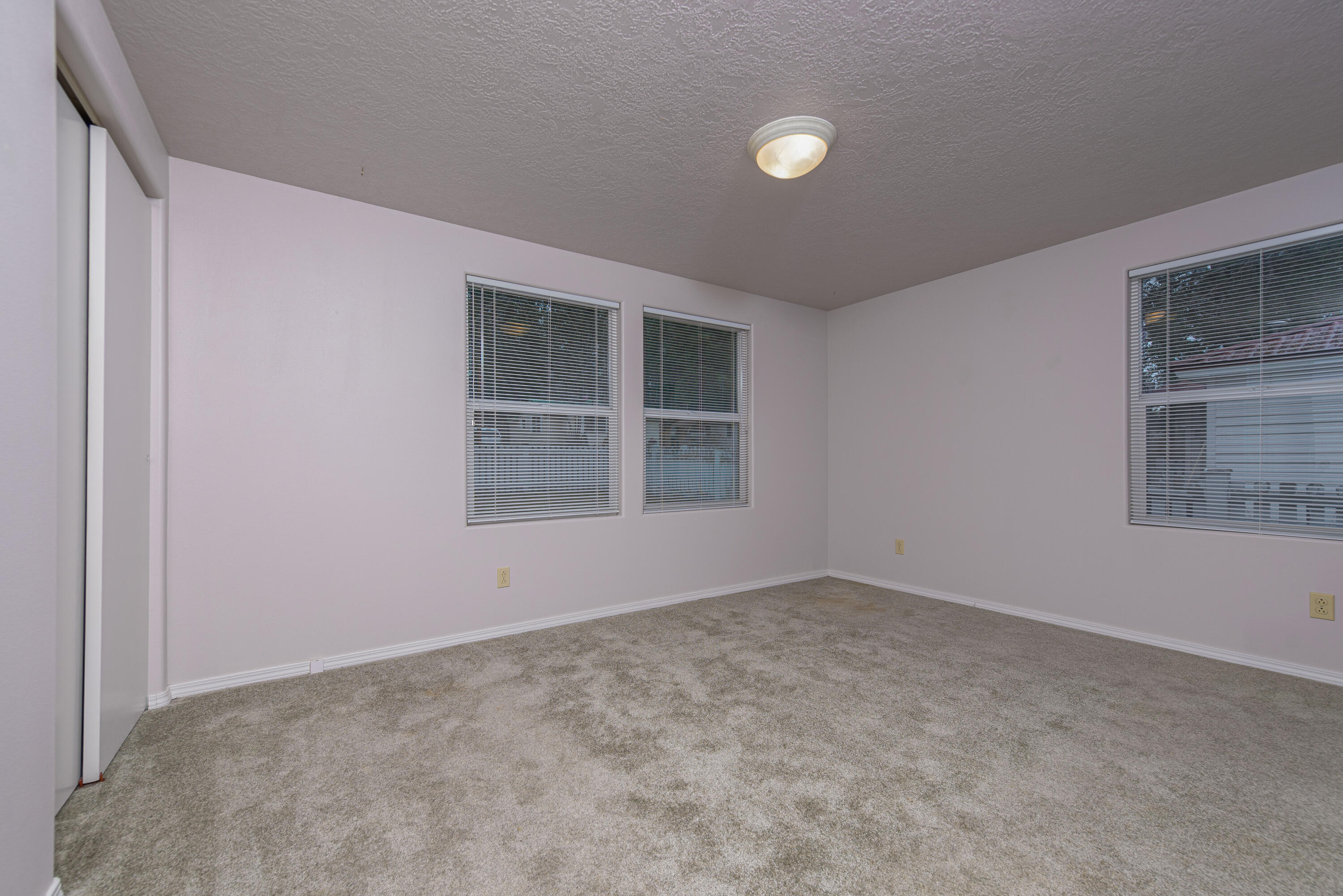 138722 Rhododendron Street Gilchrist, OR 97737 - Photo 23 of 36 an empty room with windows
