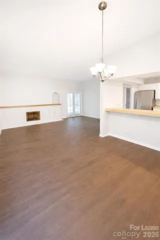 a view of a room with a ceiling fan
