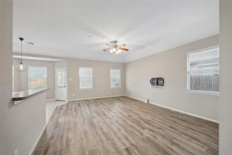 a view of a livingroom with furniture window and wooden floor