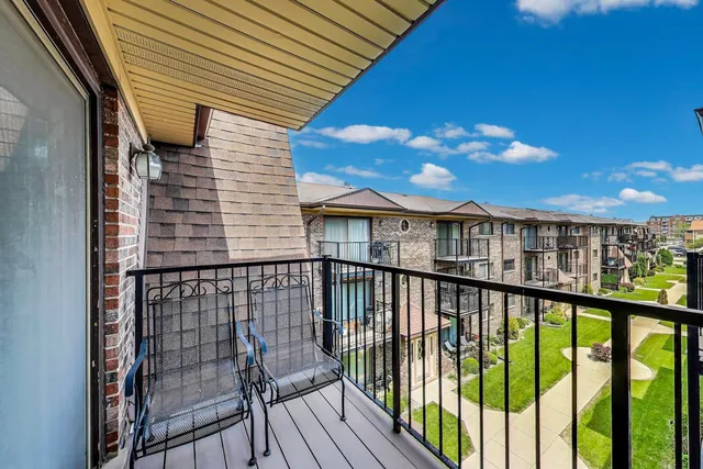 a view of a balcony with wooden floor