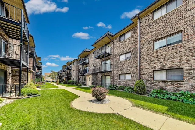 a view of a building with a yard
