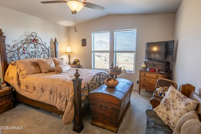 a bathroom with a sink mirror vanity and toilet