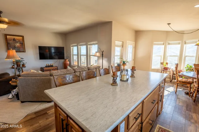 a kitchen with stainless steel appliances granite countertop a refrigerator stove top oven and sink