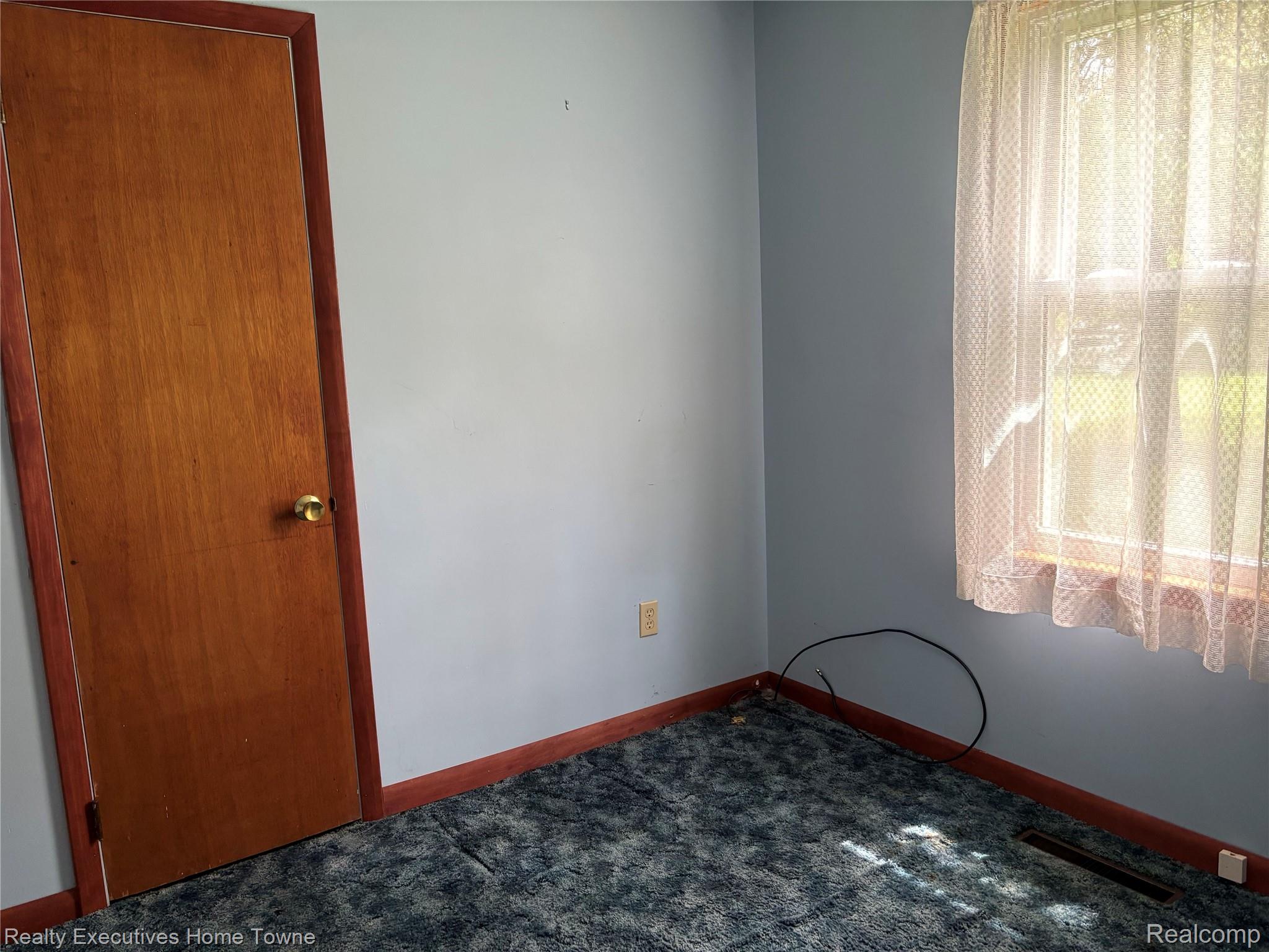 1782 Maple Road Smiths Creek, MI 48074 - Photo 20 of 30 2nd bedroom featuring baseboards and dark carpet