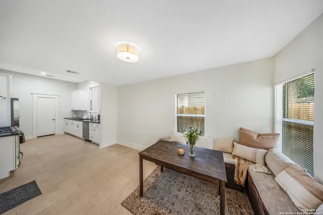 a living room with furniture and a window