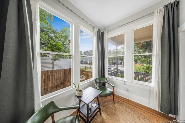 a living room with furniture and a window