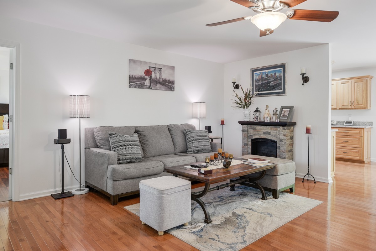 1555 Heller Ridge Spring Hill, TN 37174 - Photo 11 of 50 a living room with furniture a fireplace and a table