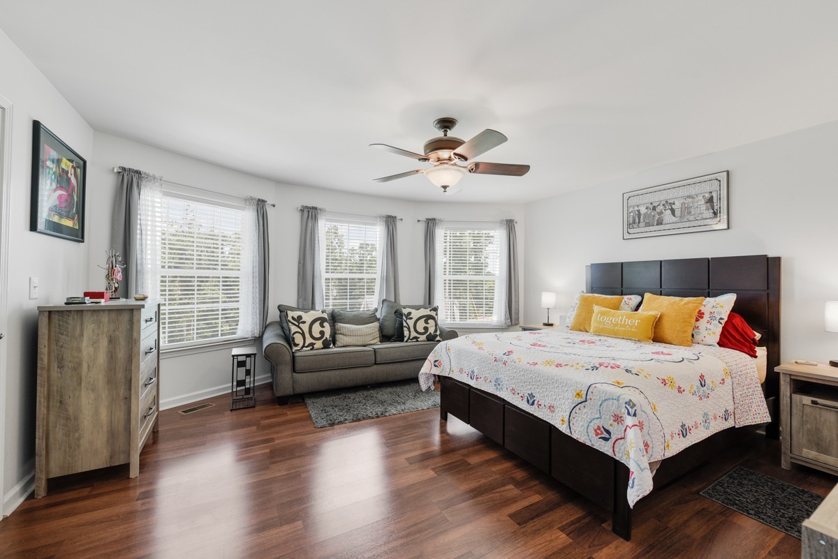 1555 Heller Ridge Spring Hill, TN 37174 - Photo 20 of 50 a bedroom with a bed and a couch