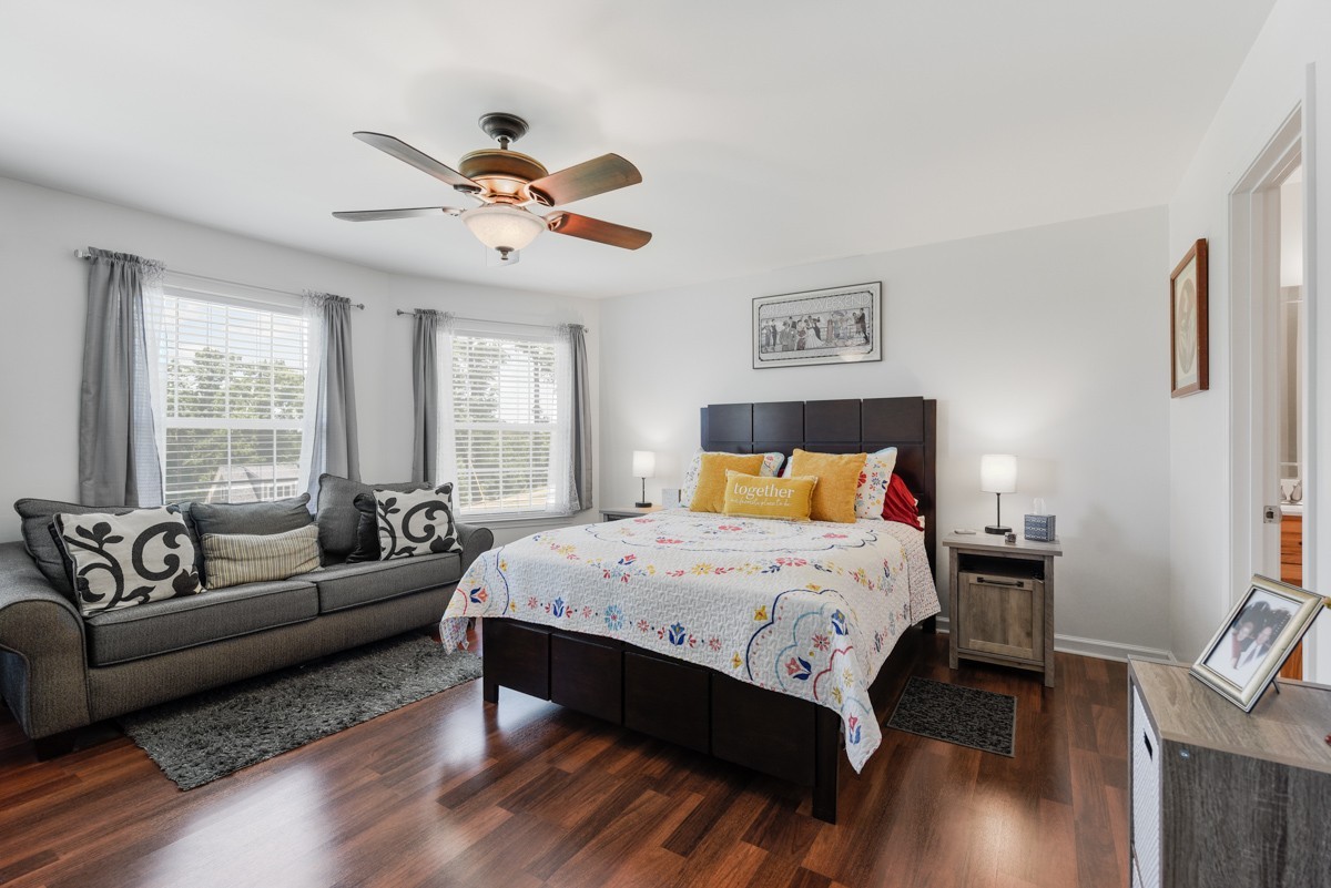 1555 Heller Ridge Spring Hill, TN 37174 - Photo 22 of 50 a bedroom with a bed couch and a window