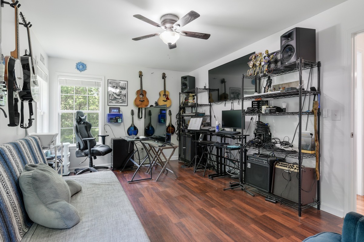 1555 Heller Ridge Spring Hill, TN 37174 - Photo 28 of 50 a living room with lots of furniture and a kitchen view
