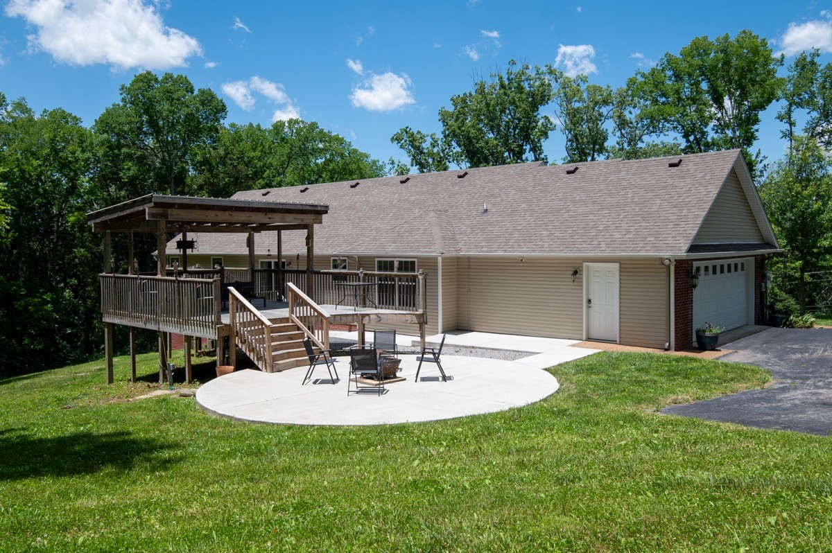 1555 Heller Ridge Spring Hill, TN 37174 - Photo 30 of 50 a view of a chair and table in backyard of the house