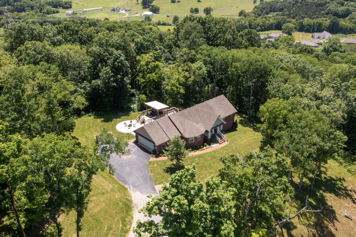 1555 Heller Ridge Spring Hill, TN 37174 - Photo 3 of 50 an aerial view of a house with yard and outdoor seating